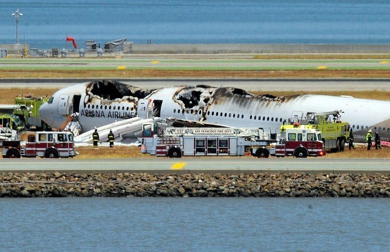 An Asiana Airlines Boeing 777 passenger jet crashed and burst into flames as it landed short of the runway at San Francisco International Airport, killing two people and injuring 182 others