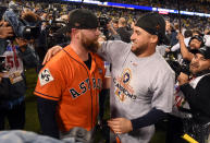 <p>Brian MCCann #16 and George Springer #4 of the Houston Astros celebrate after the final out of Game 7 of the 2017 World Series against the Los Angeles Dodgers at Dodger Stadium on Wednesday, November 1, 2017 in Los Angeles, California. The Astros defeated the Dodgers 5-1. (Photo by LG Patterson/MLB Photos via Getty Images) </p>