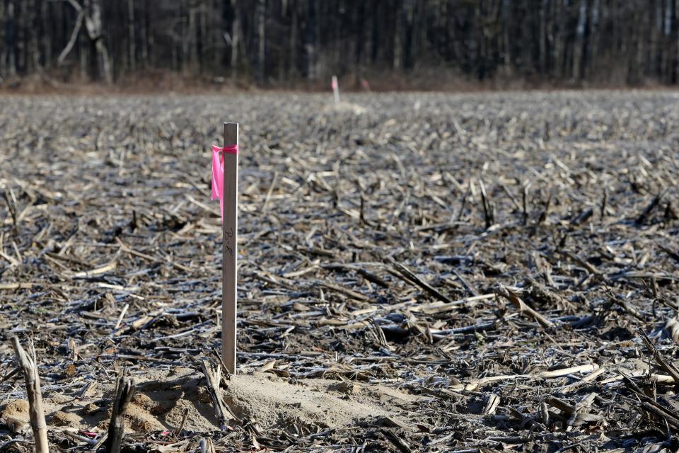 Stakes mark the site of soil borings where groundwater was studied on the potential site of a county highway garage and county park on Anderson Road, just east of Beech Road, in Granger, as seen on March 15, 2023.