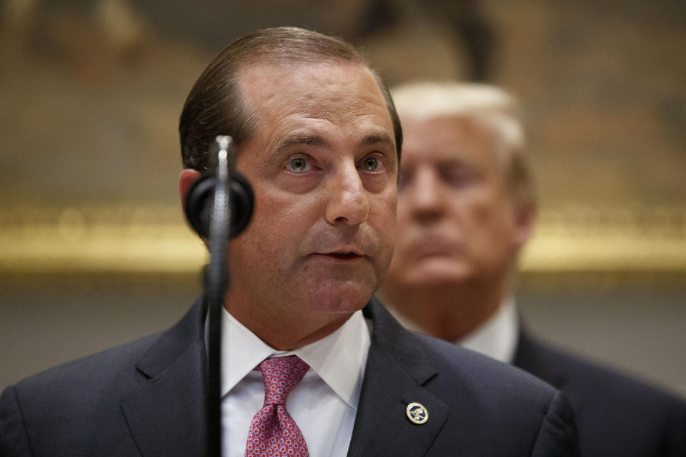 FILE - In this Sept. 4, 2019, file photo, Health and Human Services Secretary Alex Azar speaks, with President Donald Trump behind him, in the Roosevelt Room of the White House in Washington. An Austrian doctor who prescribes abortion drugs to patients around the world is suing the United States for allegedly blocking her American patients from getting abortions by seizing their prescriptions. Dr. Rebecca Gomperts filed the lawsuit in U.S. District Court in Idaho on Monday, Sept. 9. 2019, against Azar and others. (AP Photo/Alex Brandon, File)