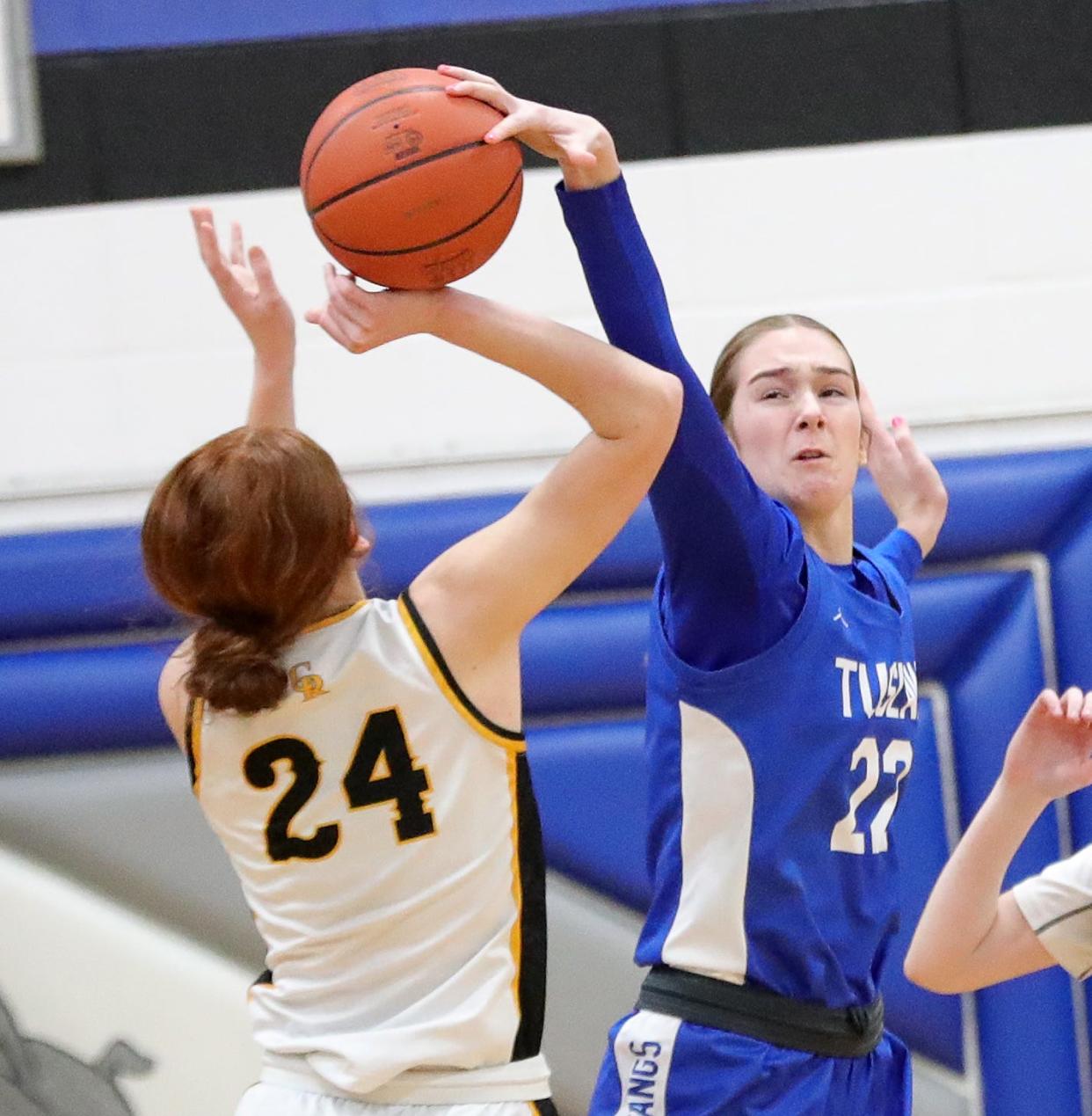 Tuslaw's Destiny Dulkoski, right, blocks a shot by Crestview's Luvrain Gaskins (24) during a Division III district semifinal, Wednesday, Feb. 28, 2024, at Lakeview High School.