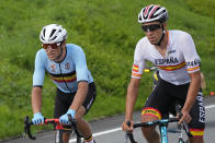 Omar Fraile Matarranz of Spain, right, and Greg van Avermaet of Belgium compete during the men's cycling road race at the 2020 Summer Olympics, Saturday, July 24, 2021, in Oyama, Japan. (AP Photo/Christophe Ena)