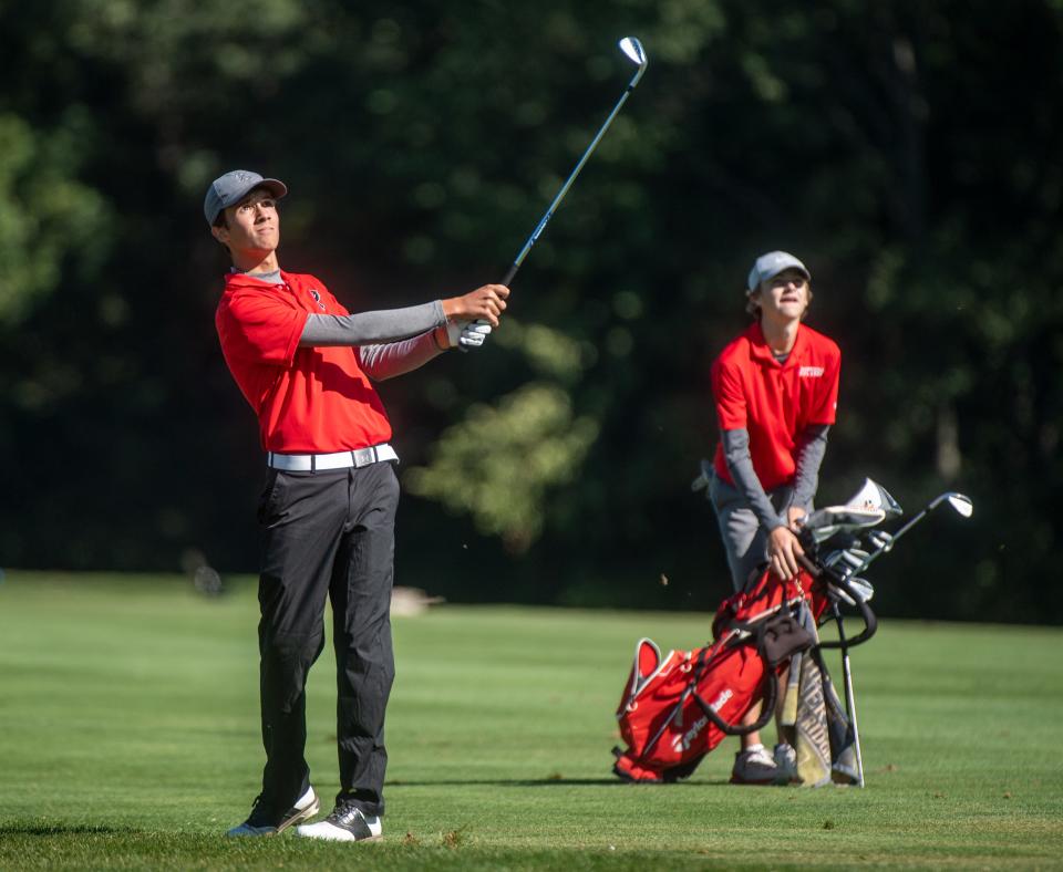 Carter Stevenson of Pekin and Jacob Anderson of Morton watch Stevenson's drive from the fairway on No. 9 during the Mid-Illini Boys Golf Championship on Thursday, Sept. 23, 2021 at Pine Lakes Golf Course in Washington.