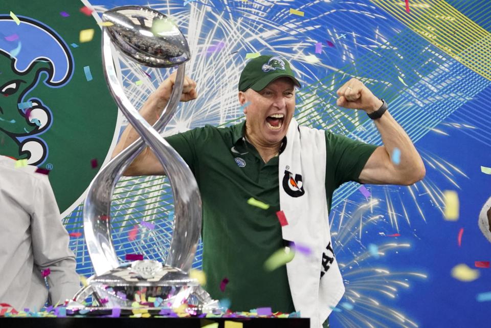 Tulane head coach Willie Fritz celebrates with the trophy after the Cotton Bowl NCAA college football game against Southern California, Monday, Jan. 2, 2023, in Arlington, Texas. (AP Photo/Sam Hodde)