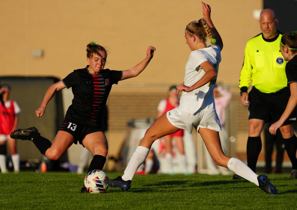 Muskego's Taylor Collins (13) battles Franklin's Ella Gromowski during the match last week. Muskego won, 4-0, to leapfrog Franklin in the rankings.