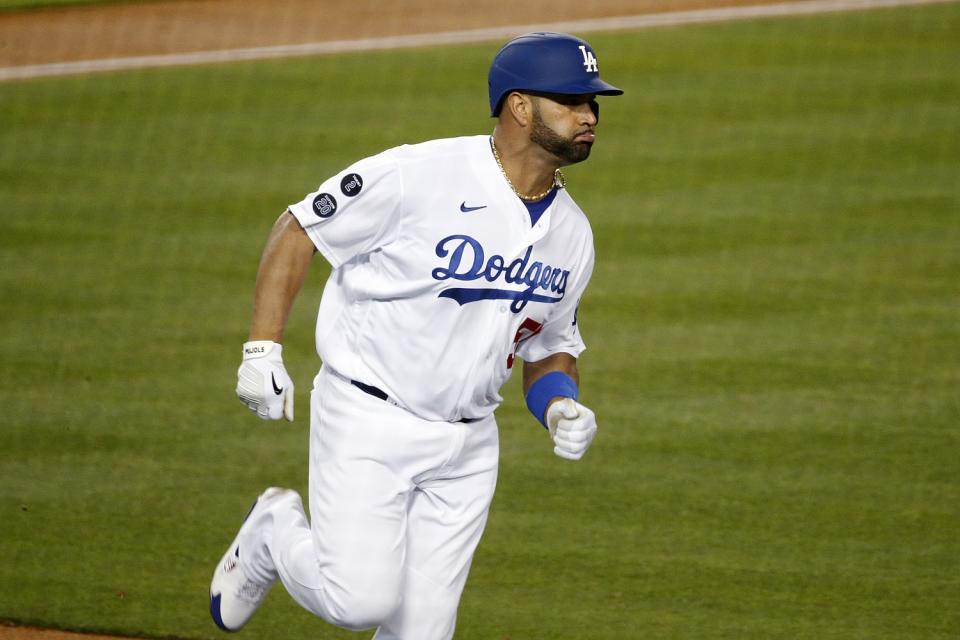 Dodgers first baseman Albert Pujols singles to center field.