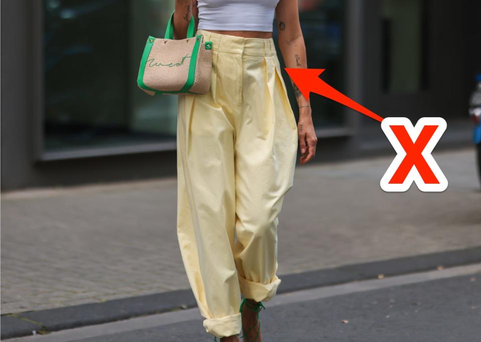 An x pointing at high-waisted pants.
