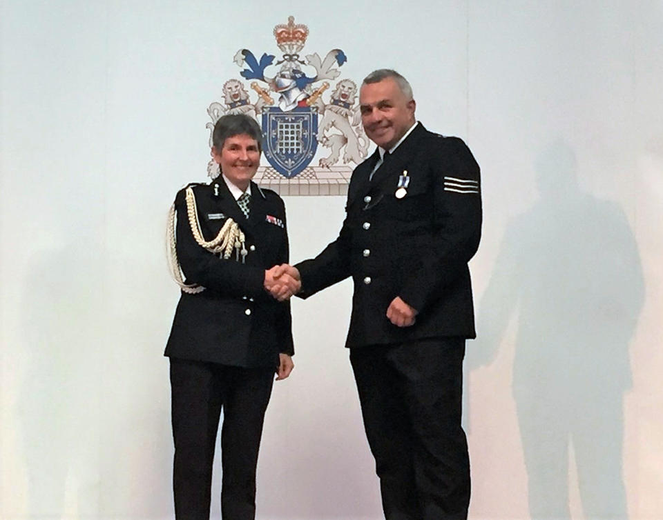 Metropolitan Police handout photo of Sergeant Matiu Ratana, known as Matt, receiving a long and good service medal from the Commissioner Cressida Dick on 31 May 2017. Sgt Ratana died after being shot at a police station in Croydon, south London.