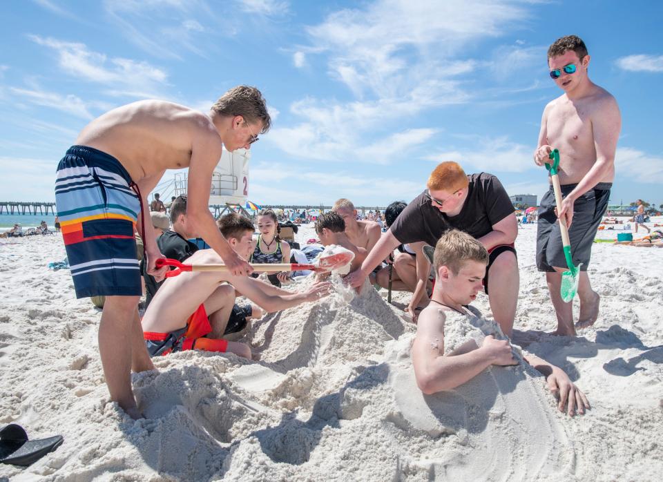 Cadets from the Navy Junior Reserve Officers Training Corps at Pendleton County High School in Kentucky enjoy the sand and sun Thursday during spring break at Pensacola Beach.