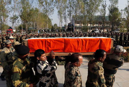 Indian Border Security Force (BSF) troopers carry the coffin of their fallen colleague who was killed in a gunfight with militants at an Indian army camp at Baramulla on Sunday, during a wreath laying ceremony in Humhama, on the outskirts of Srinagar, October 3, 2016. REUTERS/Danish Ismail