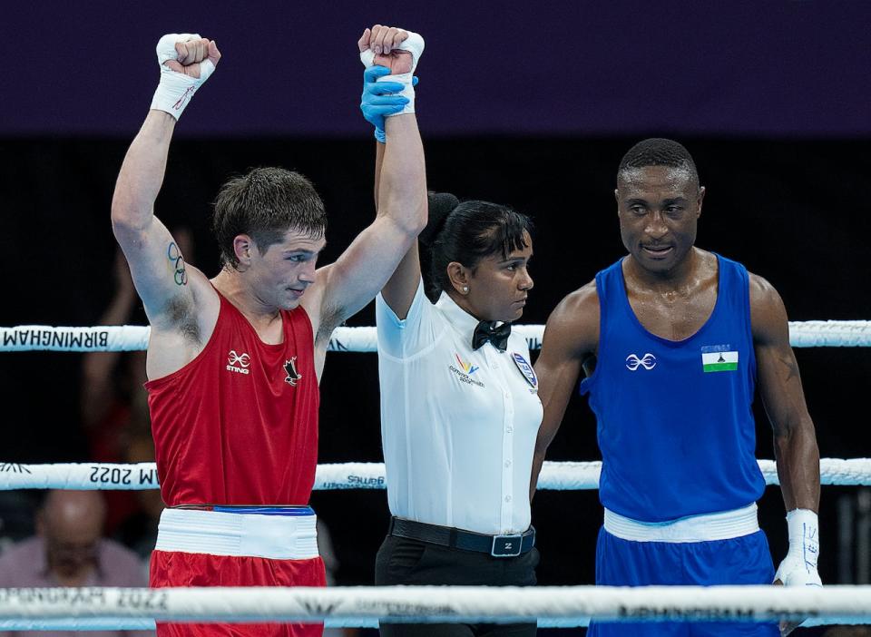 Canadian boxer Wyatt Sanford of Kennetcook, N.S., left, seen at the 2022 Commonwealth Games in Birmingham, England, will compete in the Pan Am Games in Santiago. (Andrew Vaughan/The Canadian Press - image credit)