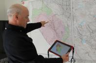 Zonehaven CEO and founder Charlie Crocker shows the how the platform assists with evacuation management using a map of the recent CZU fire at his home in San Francisco