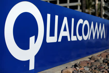 FILE PHOTO: A sign on the Qualcomm campus is seen, as chip maker Broadcom Ltd announced an unsolicited bid to buy peer Qualcomm Inc for $103 billion, in San Diego, California, U.S. November 6, 2017. REUTERS/Mike Blake/File Photo