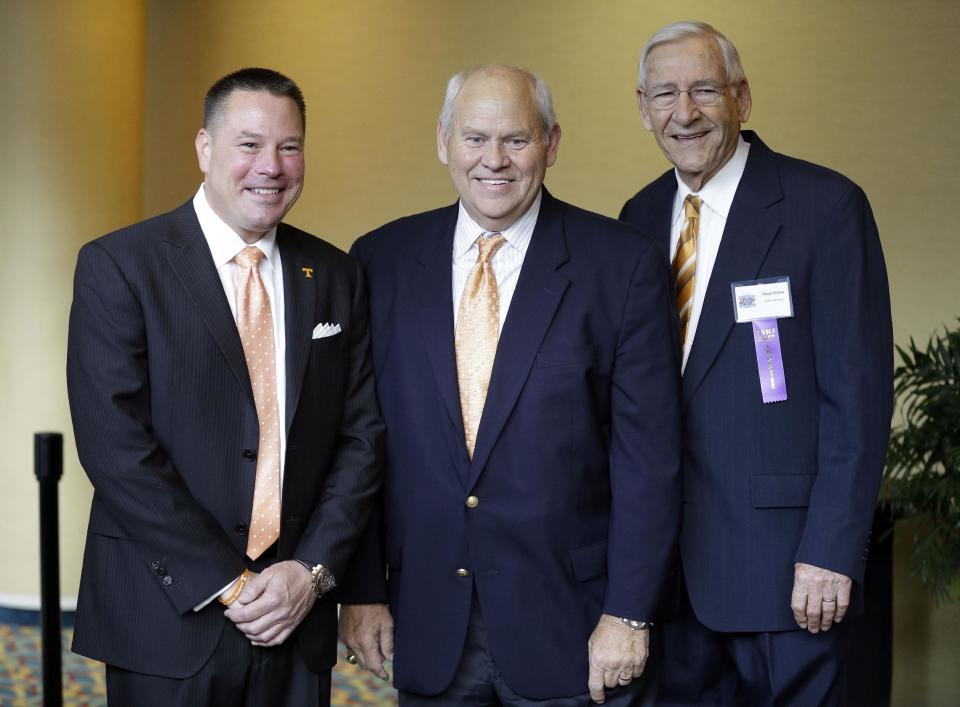 Phil Fulmer (center) will be tasked with finding the replacement for Butch Jones (L). (AP Photo/Mark Humphrey)