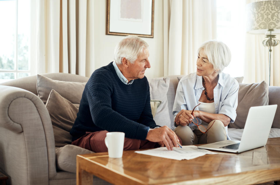 Shot of a senior couple going through their paperwork together at home