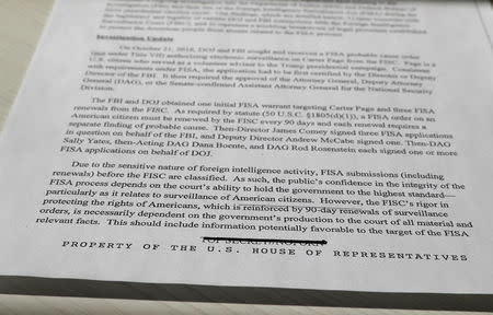 The previous stamp reading TOP SECRET / NOFORN (meaning "no foreign nationals") can be seen crossed out on a copy of the formerly top secret classified memo written by House Intelligence Committee Republican staff and declassified for release by U.S. President Donald Trump is seen shortly after it was released by the committee in Washington, February 2, 2018. REUTERS/Jim Bourg