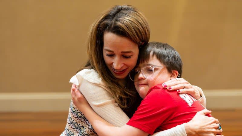 Utah first lady Abby Cox hugs Johnny Gessel, a student at Dancers Without Limits, a nonprofit program teaching dance to students with disabilities, at Creative Arts Academy in Bountiful on Tuesday.
