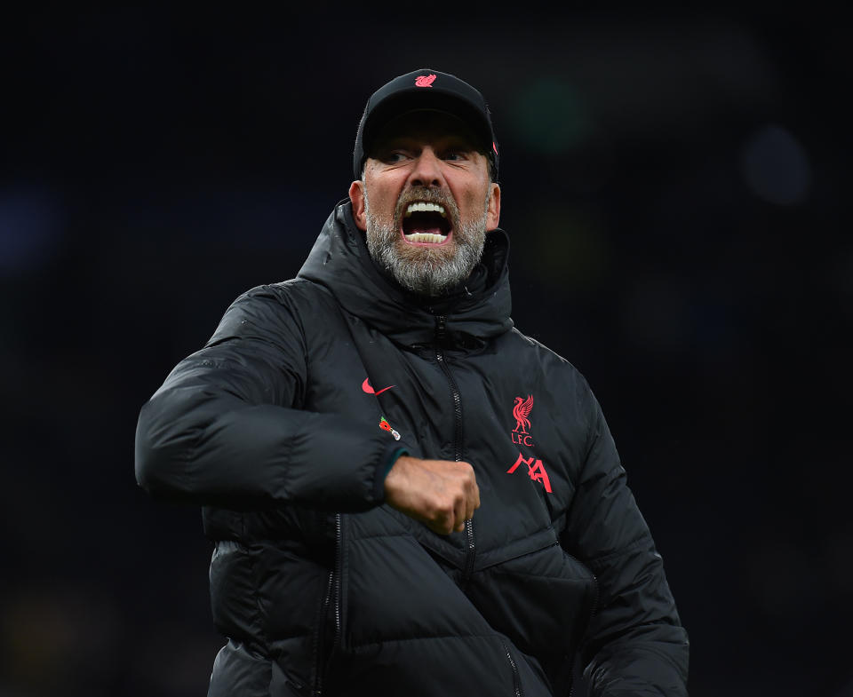 Liverpool manager Jurgen Klopp celebrates with his trademark punches towards the fans at the end of the Premier League match against Tottenham Hotspur.