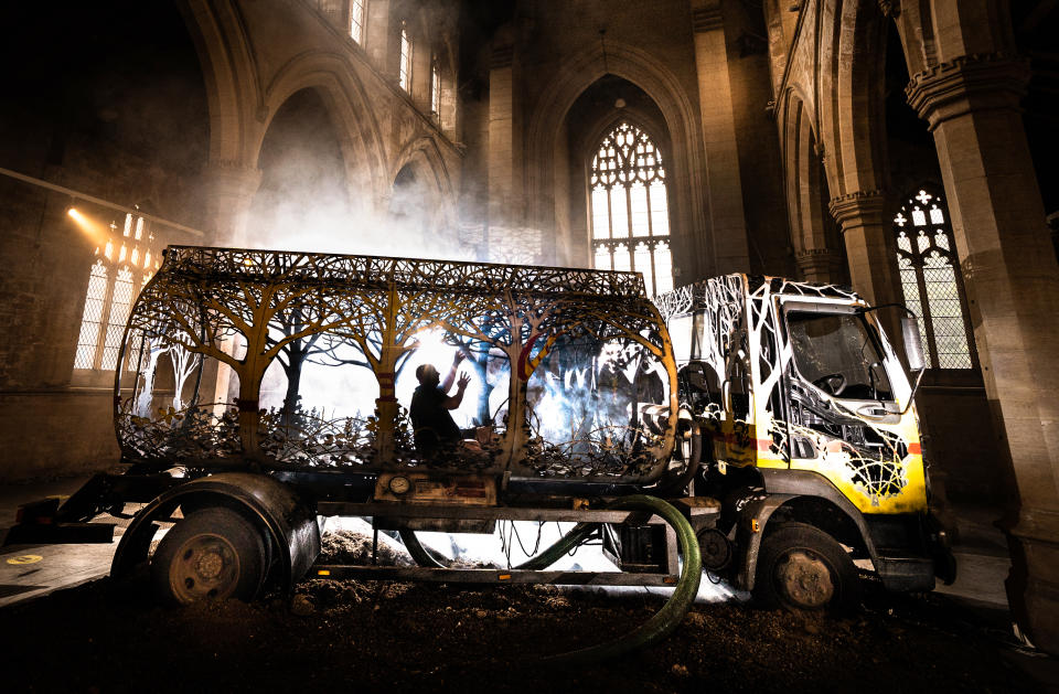 <p>Curator Dominic Mason interacts with art installation "Future Returns" by contemporary British sculptor Dan Rawlings on display at the 20-21 Visual Arts Centre in Scunthorpe, Lincolnshire. Picture date: Monday June 21, 2021.</p>
