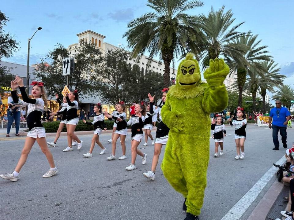 The Grinch couldn’t steal the Colts’ cheerleaders holiday fun at the 75th Annual Junior Orange Bowl Parade along Miracle Mile in Coral Gables on Dec. 10, 2023.