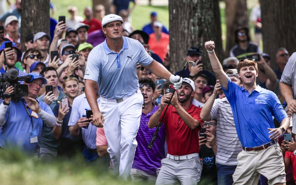 Bryson DeChambeau of the US watches his shot from the rough on the eighth hole land on the green during the third round - Shutterstock