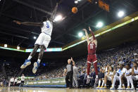 Washington State forward Andrej Jakimovski, right, shoots as UCLA forward Adem Bona defends during the first half of an NCAA college basketball game Saturday, Feb. 4, 2023, in Los Angeles. (AP Photo/Mark J. Terrill)