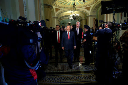 U.S. Senate Majority Leader Mitch McConnell (R-KY) (C) is flanked by U.S. Senator John Barrasso (R-WY) (L) and U.S. Senator John Cornyn (R-TX) (R) as they conclude Senate Republican party leadership elections at the U.S. Capitol in Washington, DC, U.S. November 16, 2016. REUTERS/Jonathan Ernst