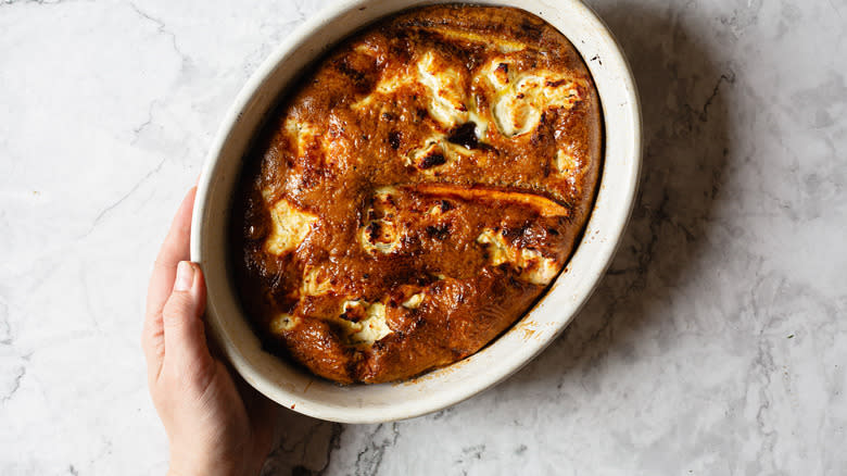 hand holding baked frittata