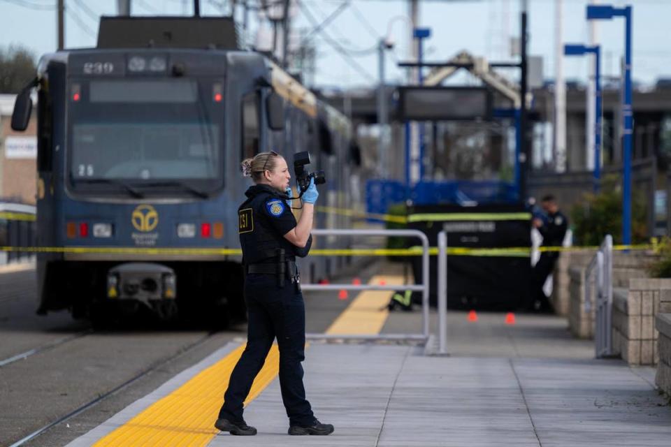 Sacramento Police investigate a shooting with one dead and two hospitalized at the 65th Street light rail station in East Sacramento on Thursday.