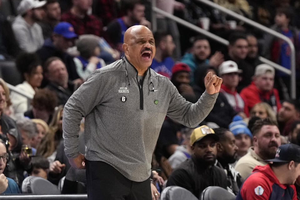 Houston Rockets assistant coach John Lucas II yells from the sideline during the first half of an NBA basketball game against the Detroit Pistons, Saturday, Jan. 28, 2023, in Detroit. (AP Photo/Carlos Osorio)