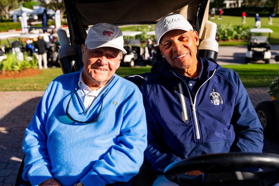 Jack Nicklaus and Reggie Jackson share a golf cart Monday during Jackson's “Mr. October Celebrity Golf Classic” at the Floridian National golf course in Palm City.