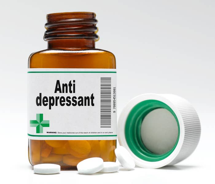 An open bottle of pills that is labeled "Anti depressant"