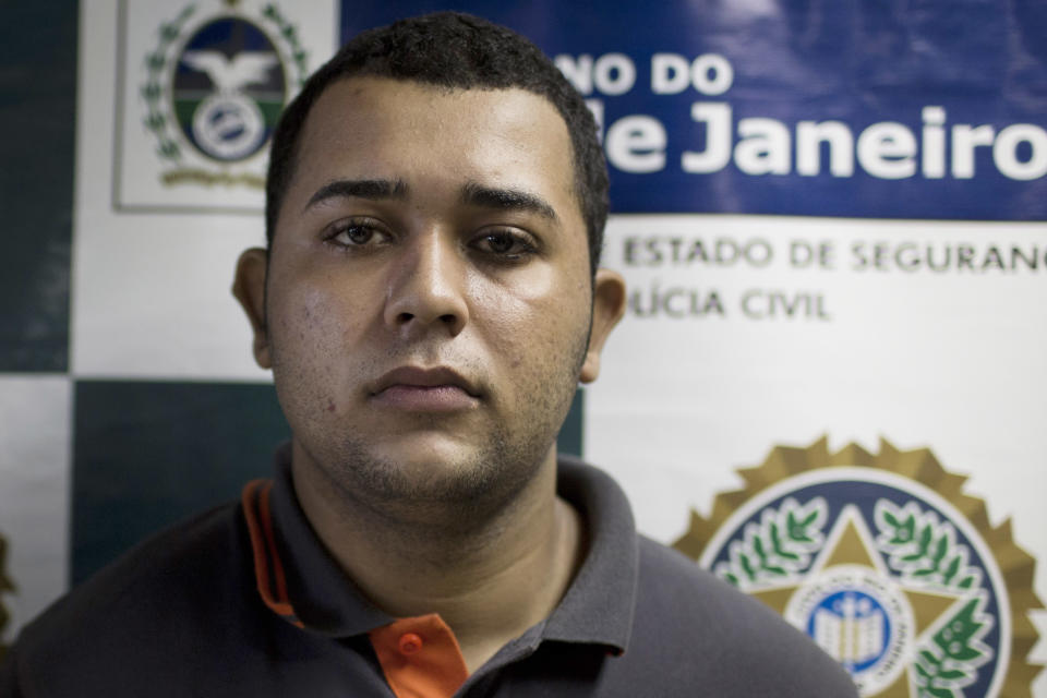 Jonathan Foudakis de Souza is presented to the press at Special Police Unit for Tourism Support (DEAT) after being arrested for allegedly attacking tourists in Rio de Janeiro, Brazil, Tuesday, April 2, 2013. An American woman was gang raped and beaten aboard a public transport van while her French boyfriend was shackled, hit with a crowbar and forced to watch the attacks after the pair boarded the vehicle in Rio de Janeiro's showcase Copacabana beach neighborhood, police said. The attacks took place over six hours starting shortly after midnight on Saturday. (AP Photo/Felipe Dana)
