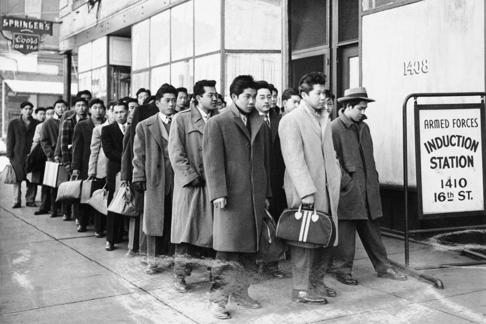 These 48 Japanese Americans from the Granada Relocation Center in Colorado reported for physical examinations for the U.S. Army at the Denver Induction Station on Tuesday, Feb. 22, 1944.