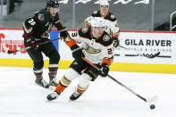 Anaheim Ducks center Sam Steel (23) skates away from Arizona Coyotes right wing Christian Fischer in the first period during an NHL hockey game, Tuesday, Jan. 26, 2021, in Glendale, Ariz. (AP Photo/Rick Scuteri)