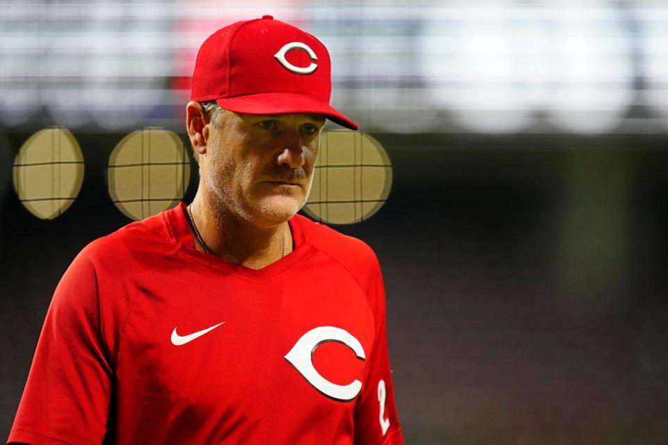 Reds Manager David Bell returns to the dugout after calling for a review in the ninth inning of an 11-4 loss to the Phillies on Aug. 16.