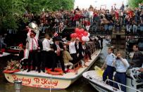 FILE PHOTO: Ajax Amsterdam striker Patrick Kluivert holds up the European Cup as thousands of supporters gather along the canals of Amsterdam to celebrate the club's victory over AC Milan in the final a day earlier