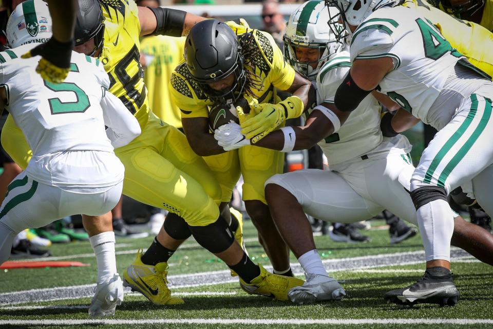 Oregon running back Jordan James pushes into the end zone for a touchdown as the Oregon Ducks host Portland State in the Ducks’ season opener Saturday, Sept. 2, 2023, at Autzen Stadium in Eugene, Ore.