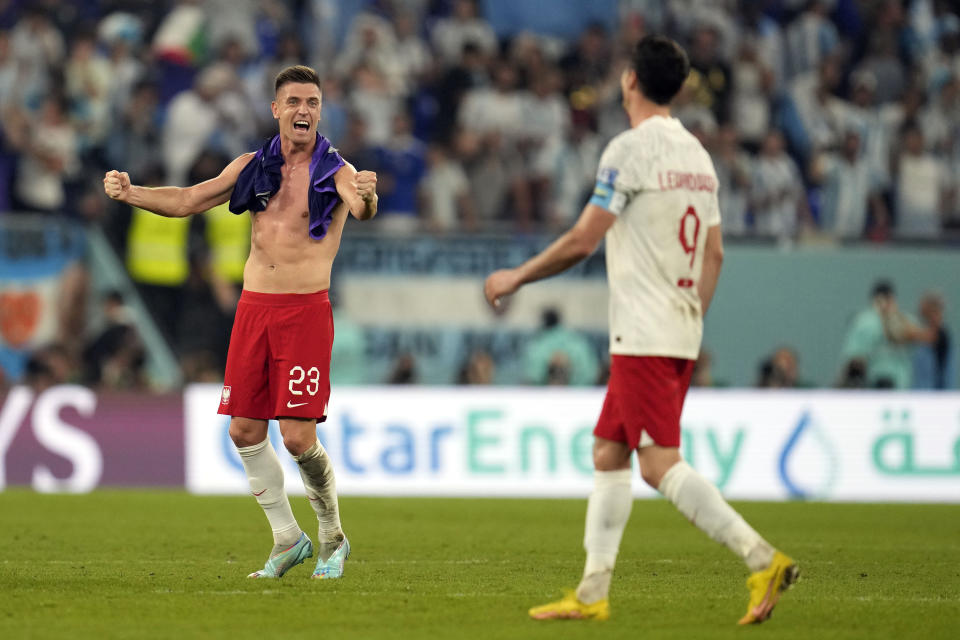 Poland's Krzysztof Piatek (23) celebrates after a World Cup group C soccer match between Poland and Argentina at the Stadium 974 in Doha, Qatar, Wednesday, Nov. 30, 2022. (AP Photo/Natacha Pisarenko)