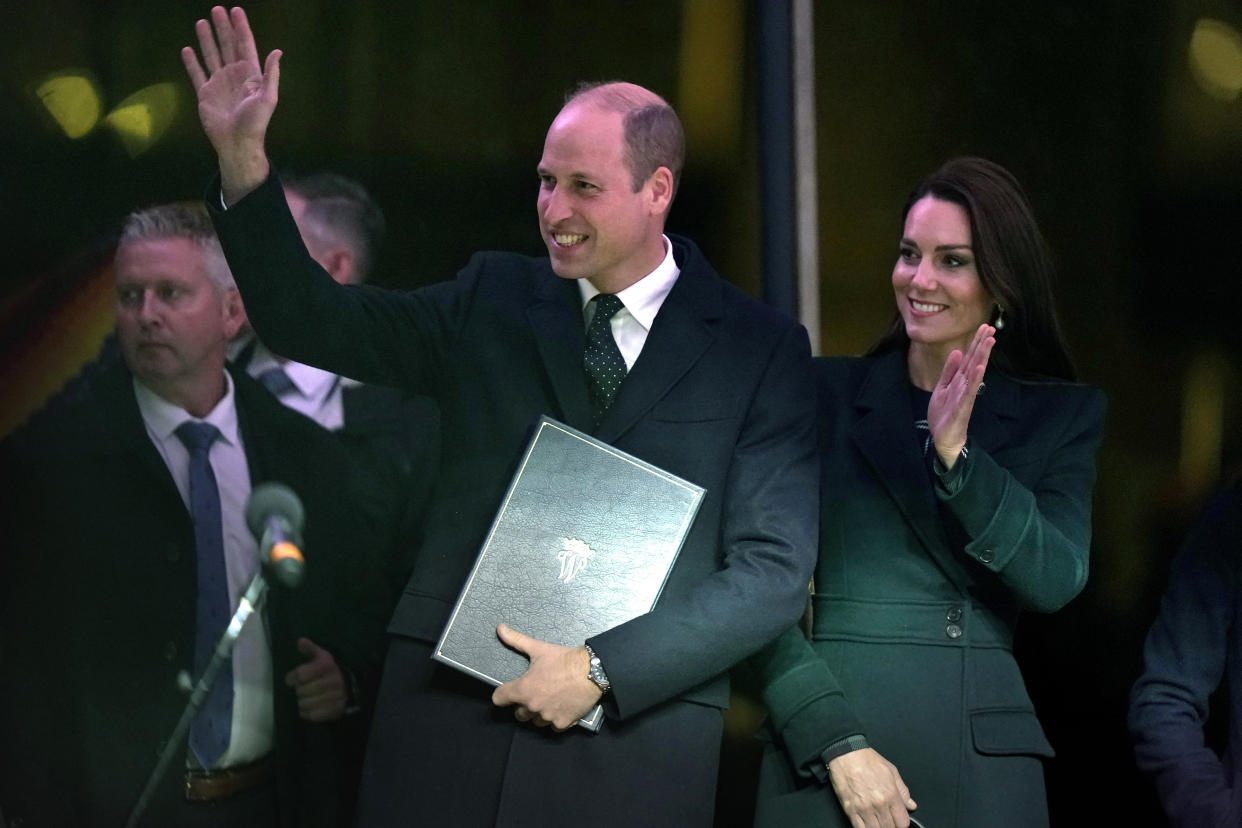 Britain's Prince William and Kate, Princess of Wales, wave to an audience as they take to the stage at the Earthshot Prize ceremony, Wednesday, Nov. 30, 2022, in Boston. (AP Photo/Steven Senne)