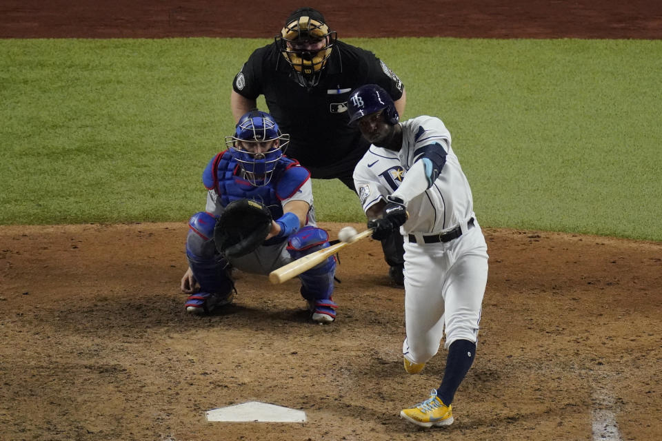 Tampa Bay Rays' Randy Arozarena hits home run during the ninth inning in Game 3 of the baseball World Series against the Los Angeles Dodgers Friday, Oct. 23, 2020, in Arlington, Texas. Dodgers beat the Rays 6-2 to lead the series 2-1 games. (AP Photo/Sue Ogrocki)