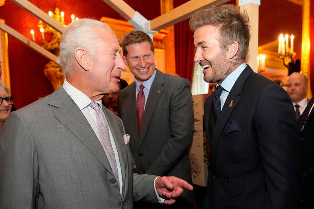 <p>KIRSTY WIGGLESWORTH/POOL/AFP via Getty</p> King Charles and David Beckham at The Kings' Foundation Awards at St. James' Palace on June 11, 2024.