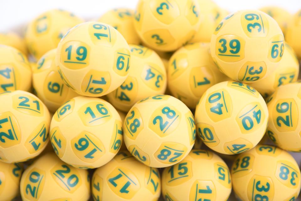 Oz Lotto balls are pictured.