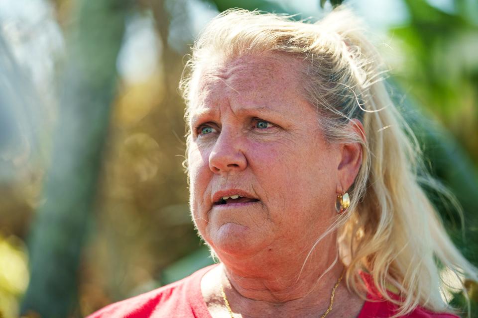 Oct 5, 2022; Fort Myers, FL, USA; Peggy Zachritz talks about how she and her husband Bruce survived severe flooding in their home and neighborhood caused by Hurricane Ian. Ian caused catastrophic damage across southwest Florida when it came ashore as a Category 4 storm.. Mandatory Credit: Josh Morgan-USA TODAY