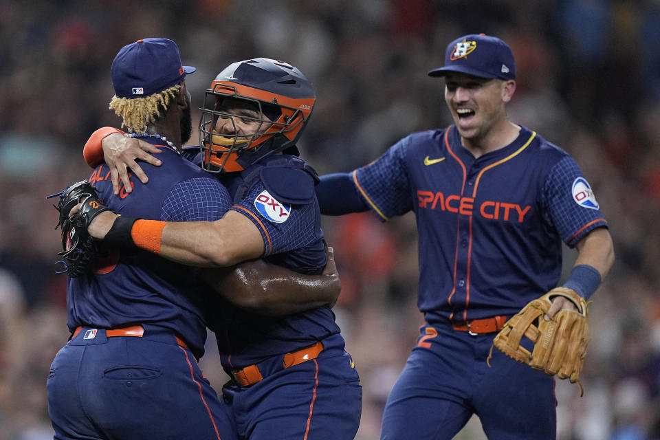 Houston Astros starting pitcher Ronel Blanco celebrates with catcher Yainer Diaz and third baseman Alex Bregman after throwing a no hitter in a baseball game against the Toronto Blue Jays, Monday, April 1, 2024, in Houston. (AP Photo/Kevin M. Cox)