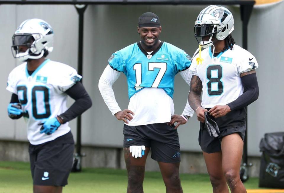 Carolina Panthers wide receiver Xavier Legette, center, speaks with cornerback Jaycee Horn, right, during the team’s OTA practice on Tuesday, June 4, 2024.