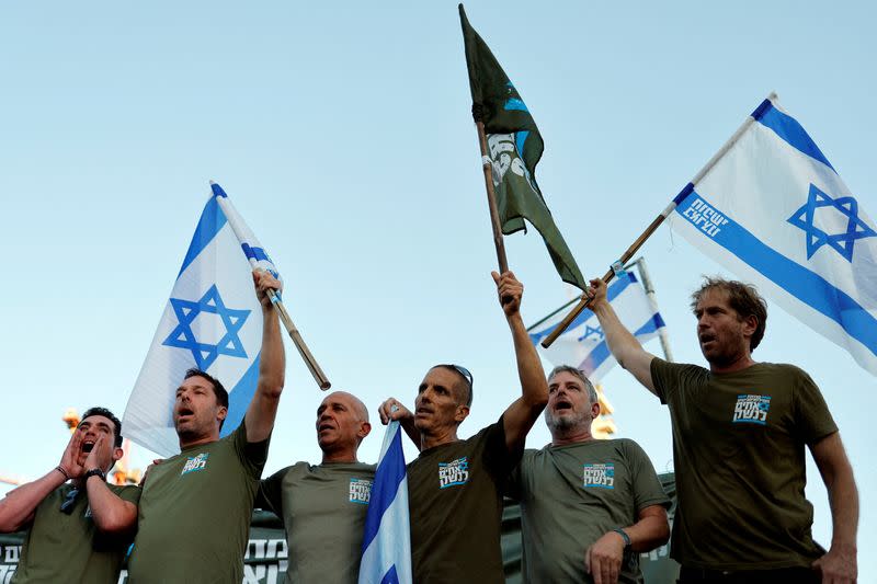 FILE PHOTO: Israeli military reservists sign pledge to suspend voluntary military service if the government passes judicial overhaul legislation near the defence ministry in Tel Aviv