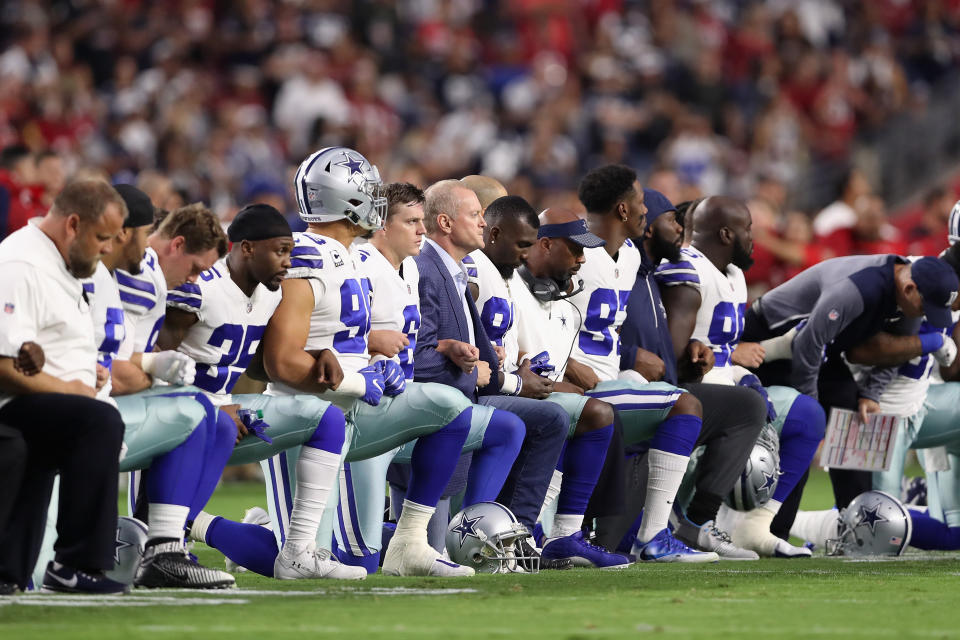 Members of the Dallas Cowboys kneel prior to a game in 2017. (Photo by Christian Petersen/Getty Images)