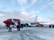 FILE PHOTO: Passengers board a Norwegian Air plane in Kirkenes