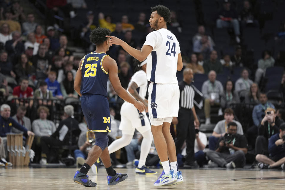 Penn State forward Zach Hicks (24) points after making a 3-point basket against Michigan during the first half of an NCAA college basketball game in the first round of the Big Ten Conference men's tournament Wednesday, March 13, 2024, in Minneapolis. (AP Photo/Abbie Parr)